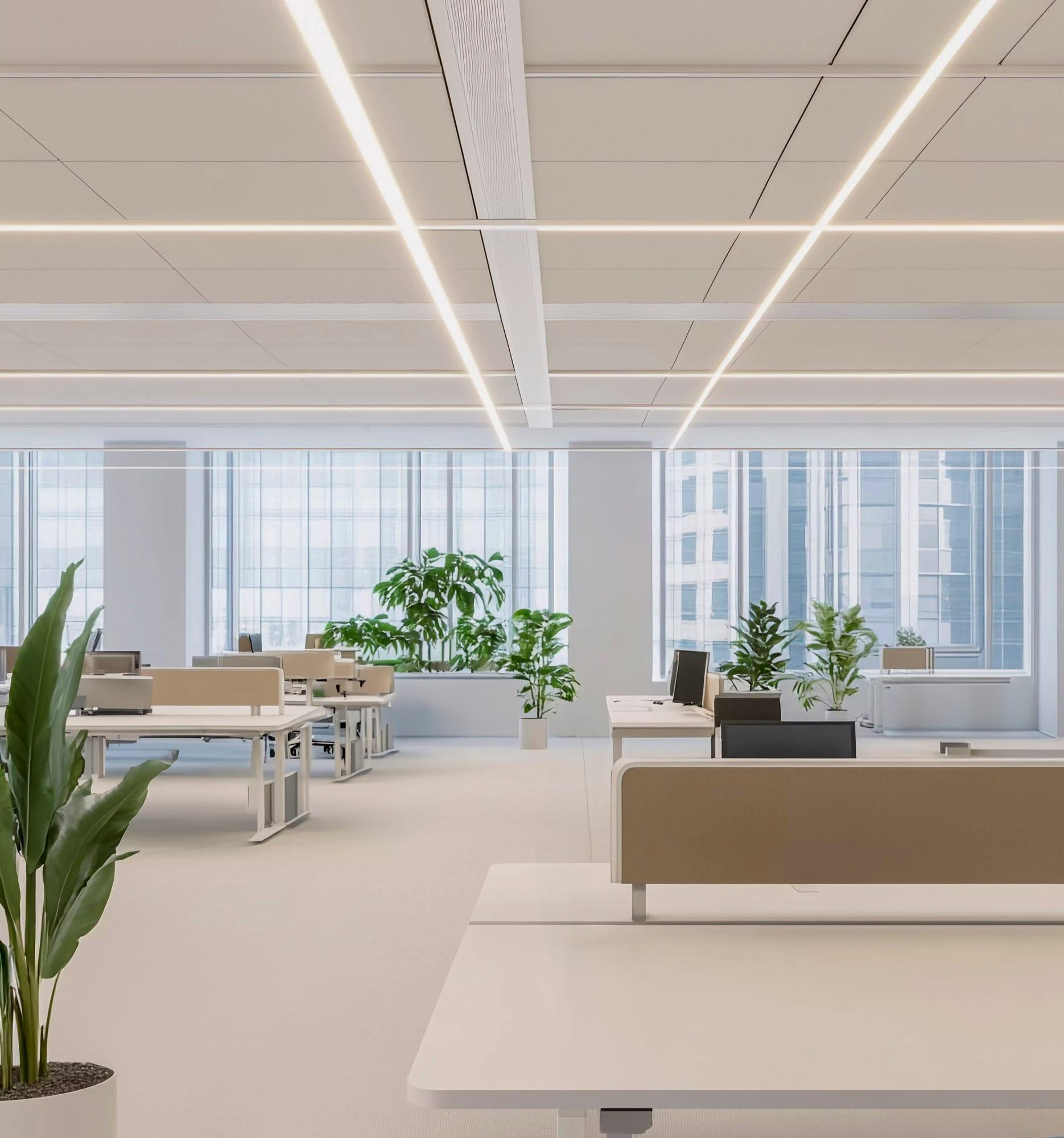 Modern office space with lighting, desks, and open collaboration areas